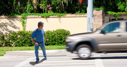 pedestrian crossing the street